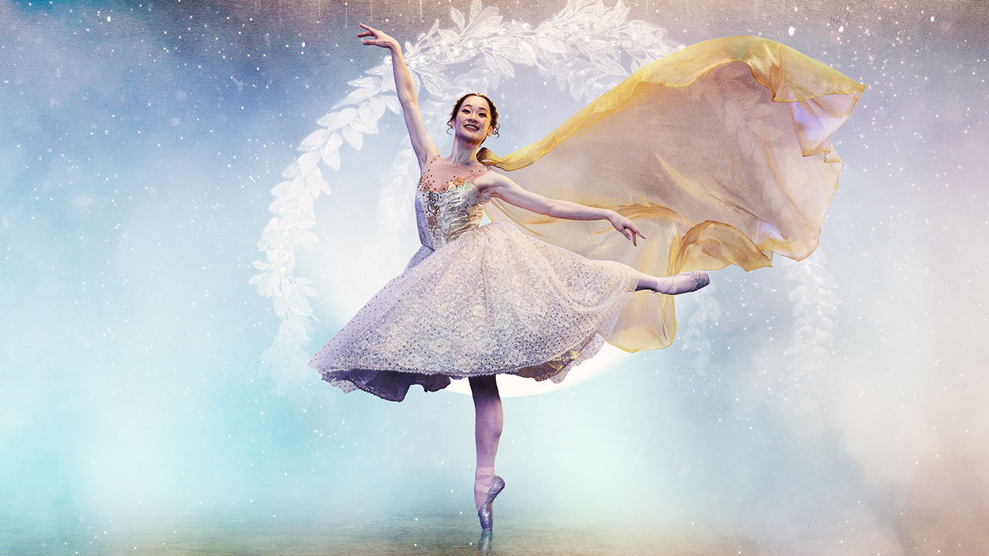 Against a blue and golden fantasy background, a woman stands on one pointed foot, one hand in the air, her other leg balanced elegantly behind her as her dress flows behind her