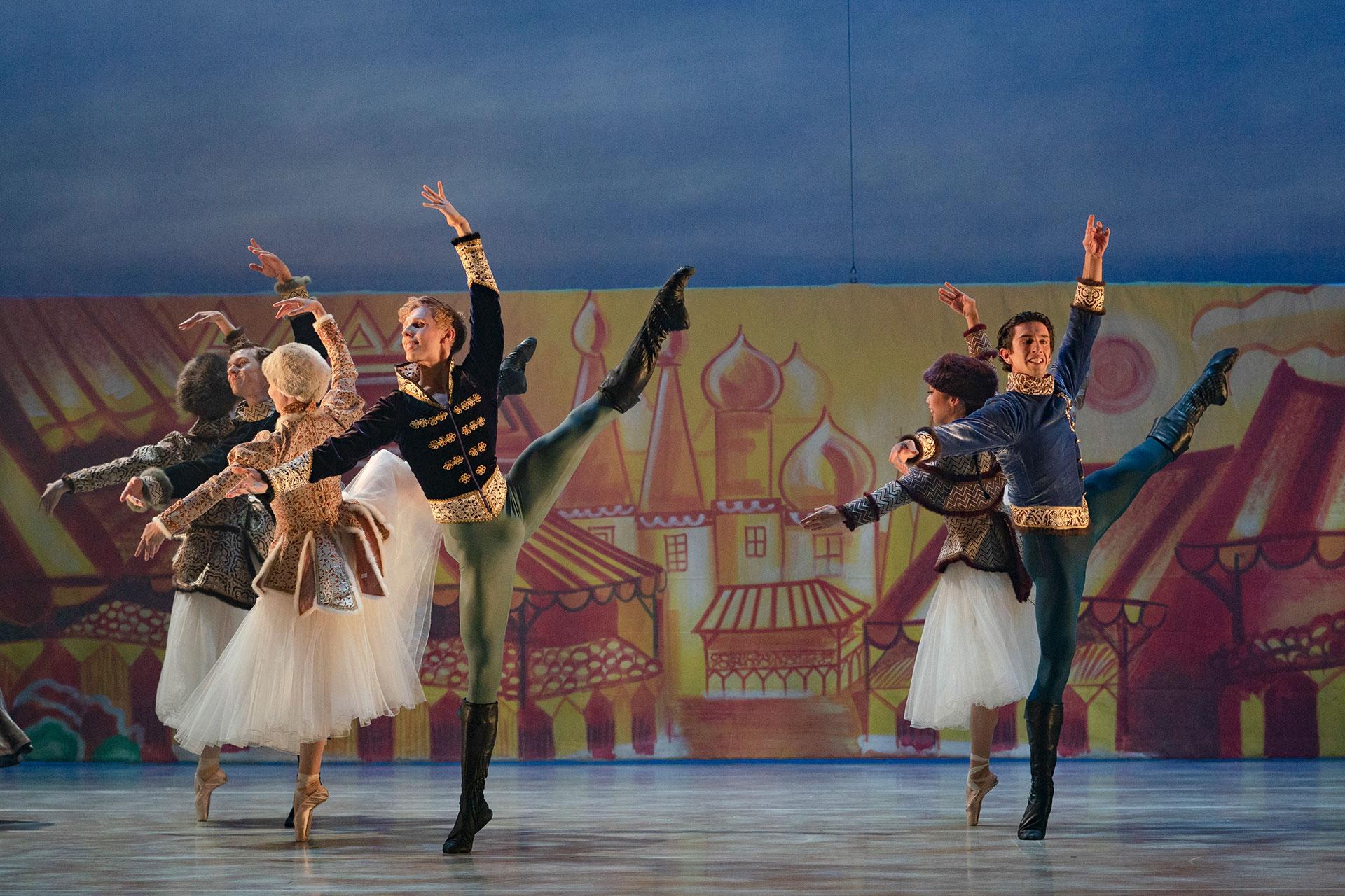 Northern Ballet dancers high-kicking together in Cinderella. Photo Emma Kauldhar.