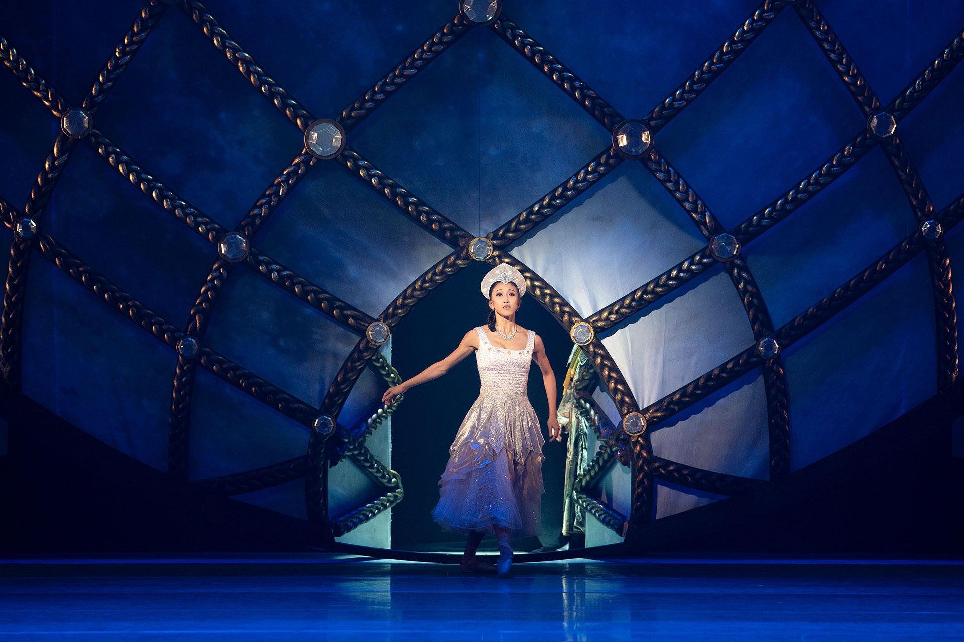 Northern Ballet dancer Minju Kang as Cinderella arriving at the Ball in a shimmering dress. Photo Emma Kauldhar.