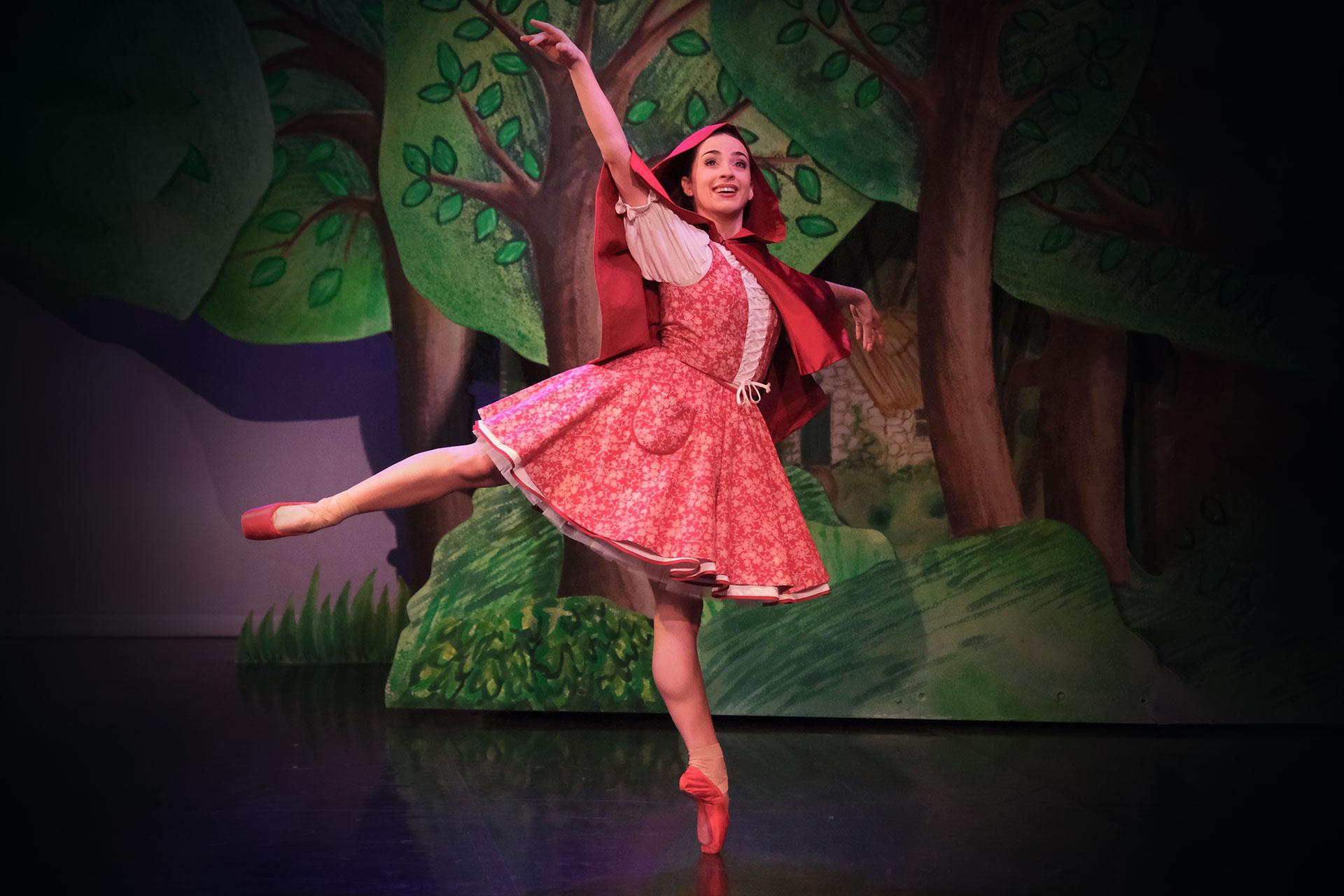 Little Red dances in her shiny red pointe shoes