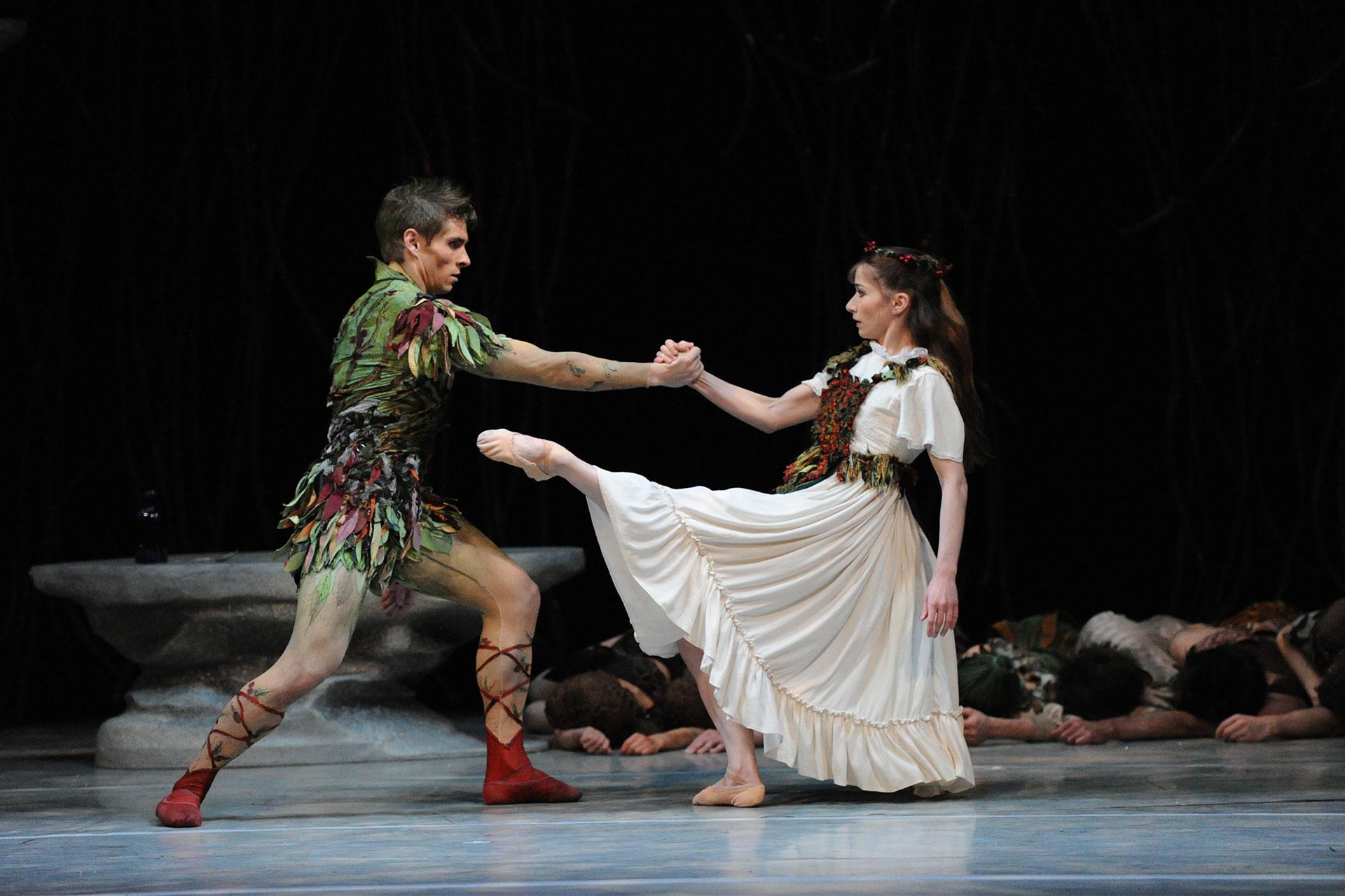 Peter and Wendy dance while the Lost Boy sleep