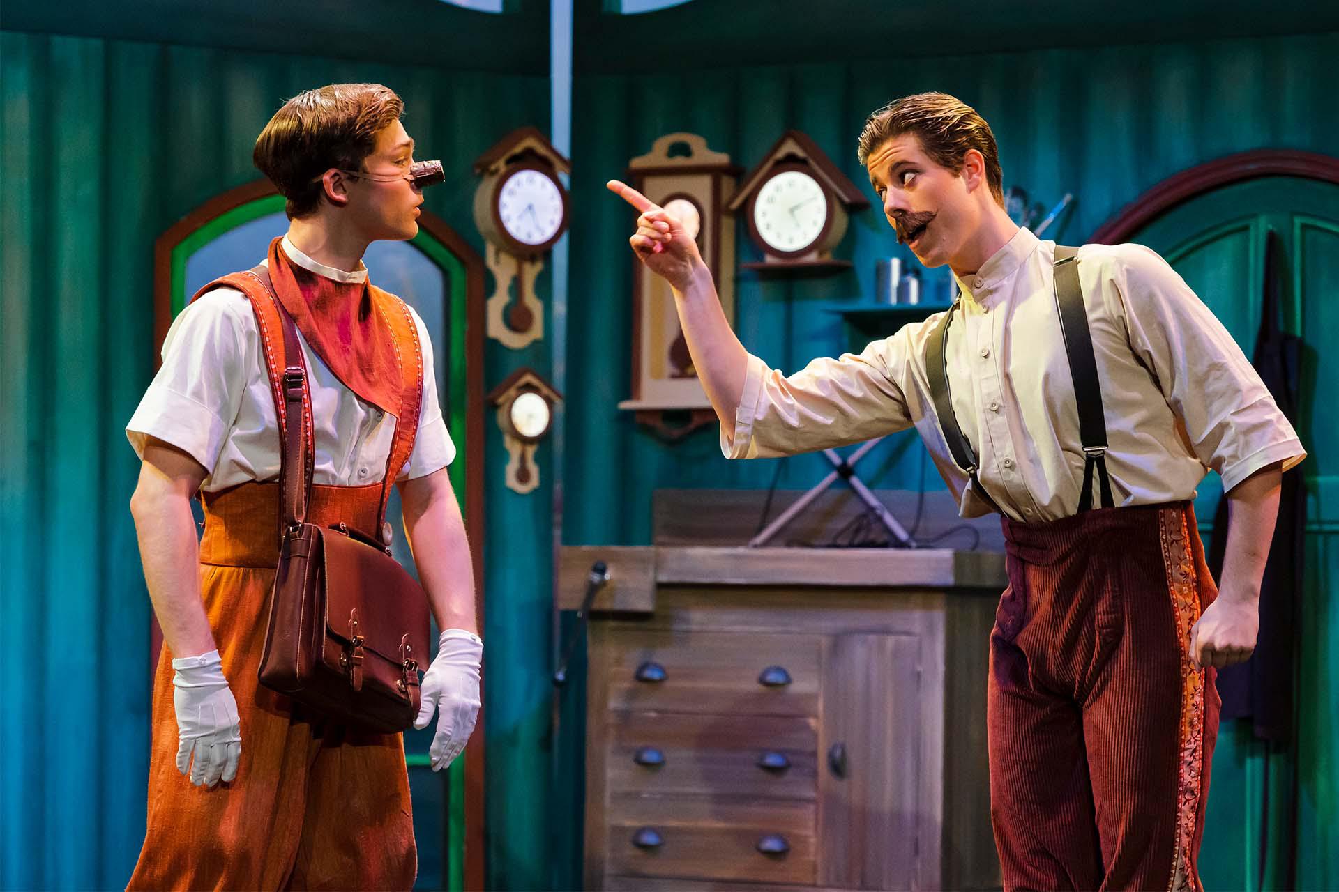 Geppetto warns Pinocchio speaking firmly and wagging a finger, while Pinocchio simply looks on petulantly