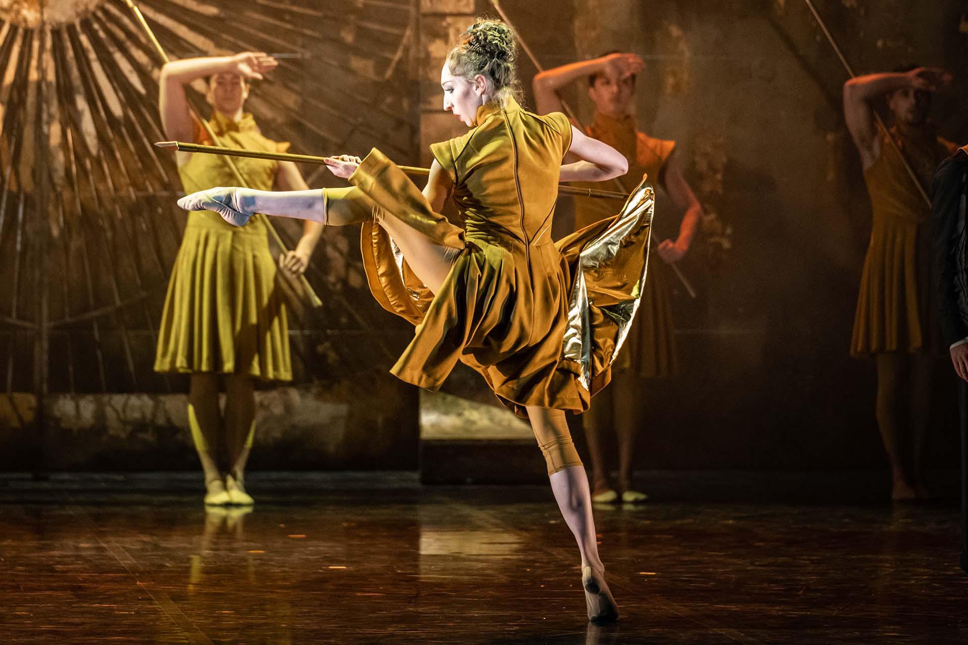 The blacksmith, now in the army, menacingly holds a pike