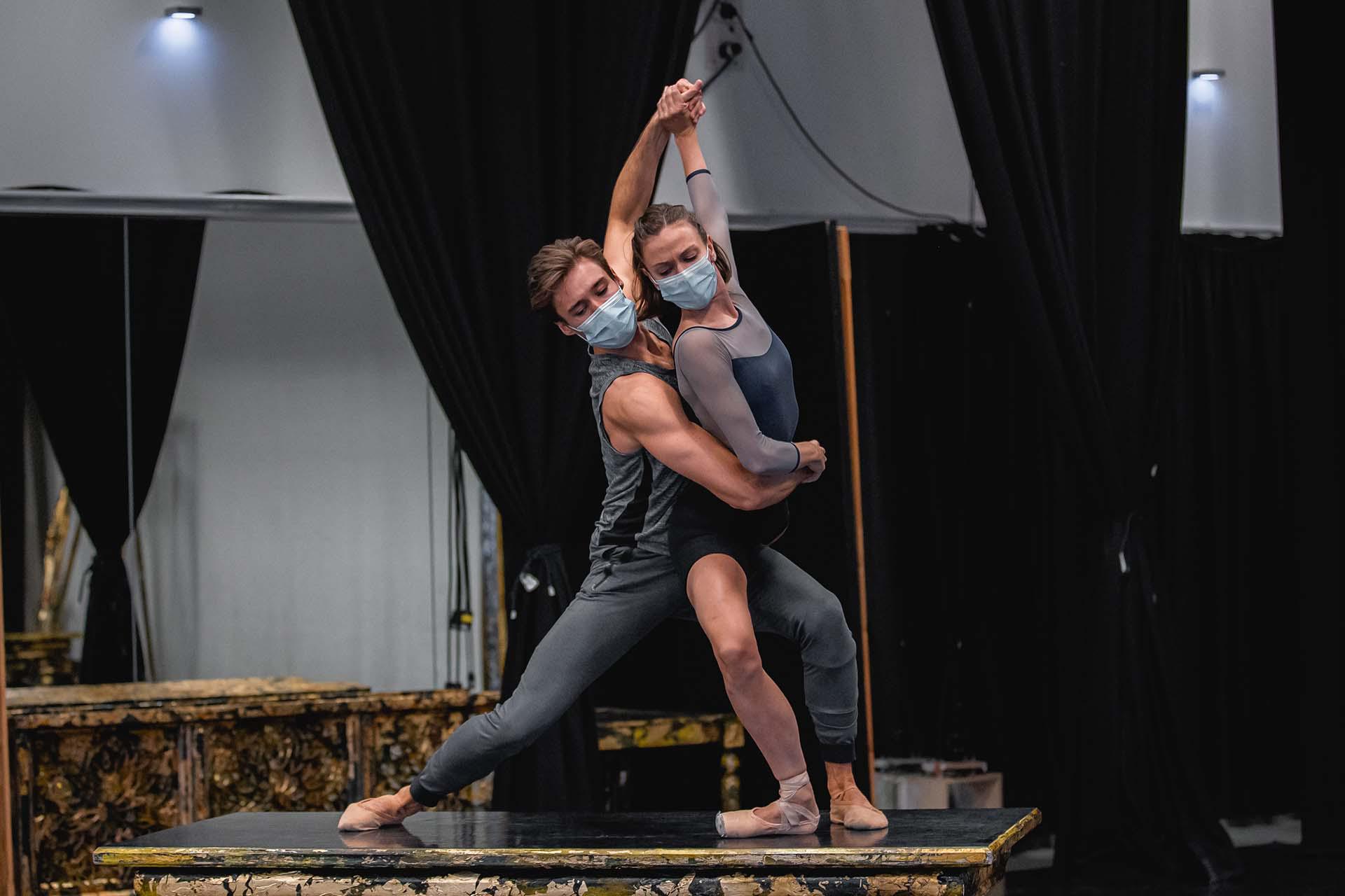 Standing on a table, Joseph Taylor and Abigail Prudames hold each other while rehearsing for their roles in Casanova.