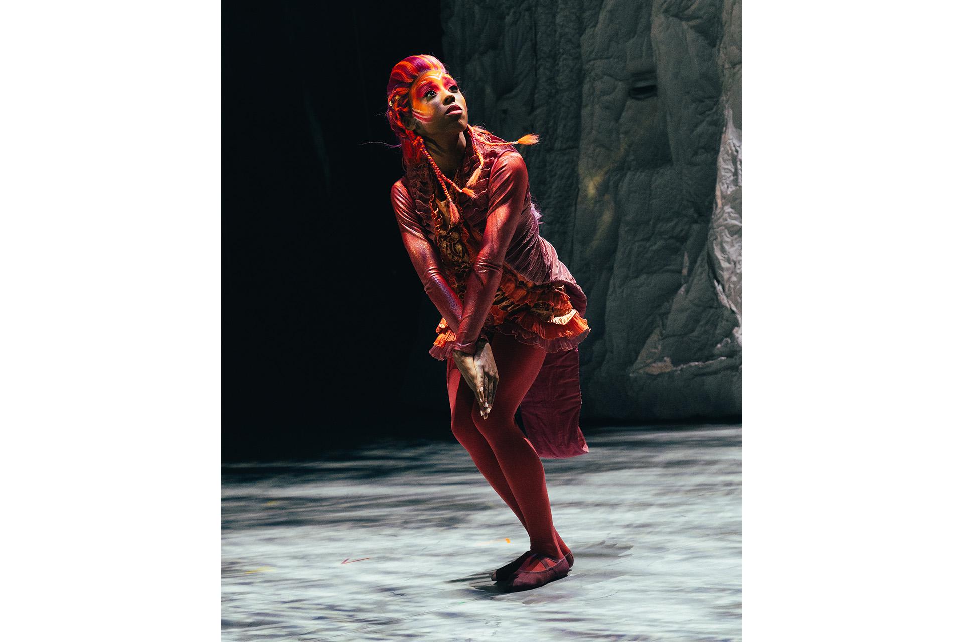 Dancer performing as a red seahorse