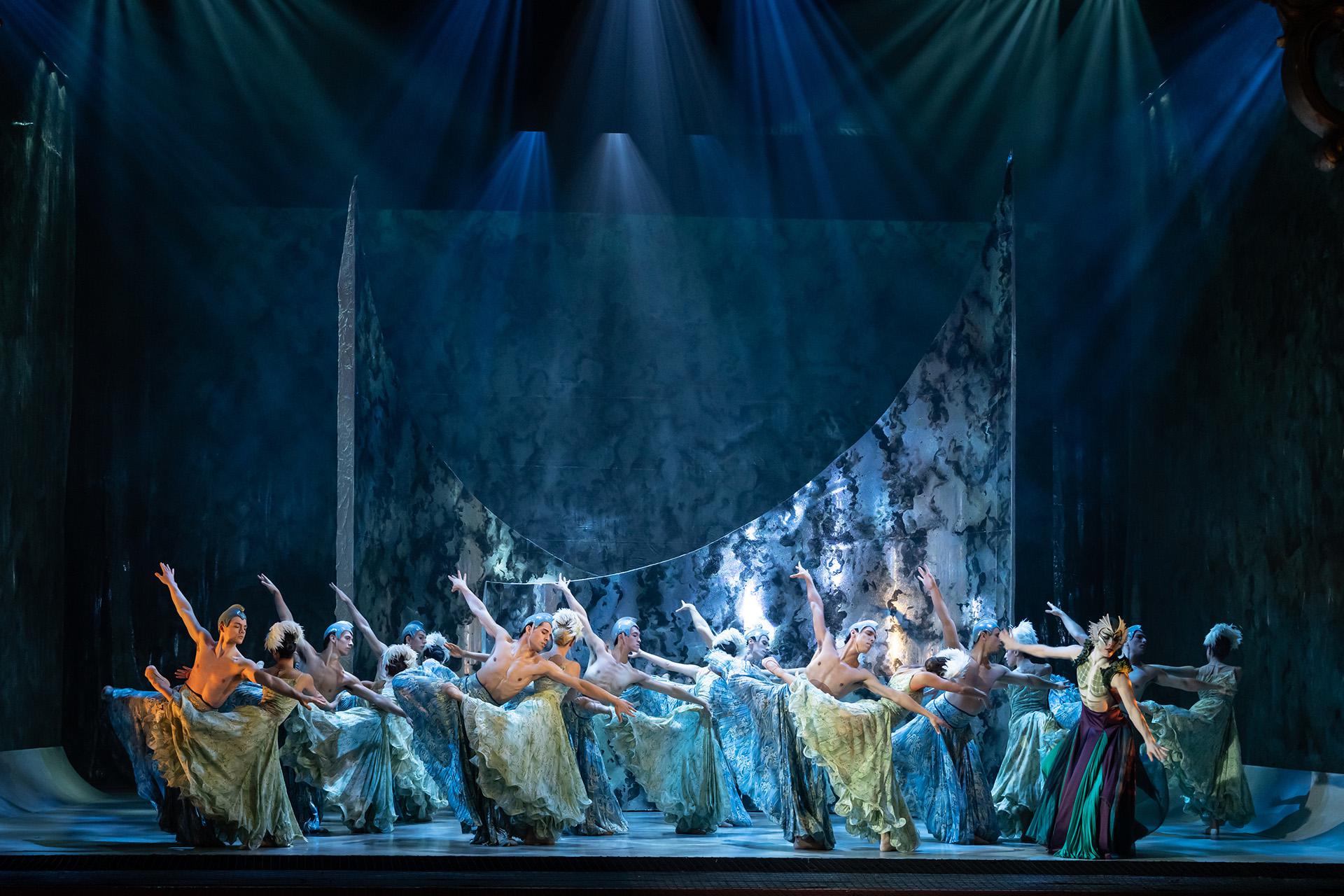 Dancers dressing in blue and green representing the sea, all dancing in unison