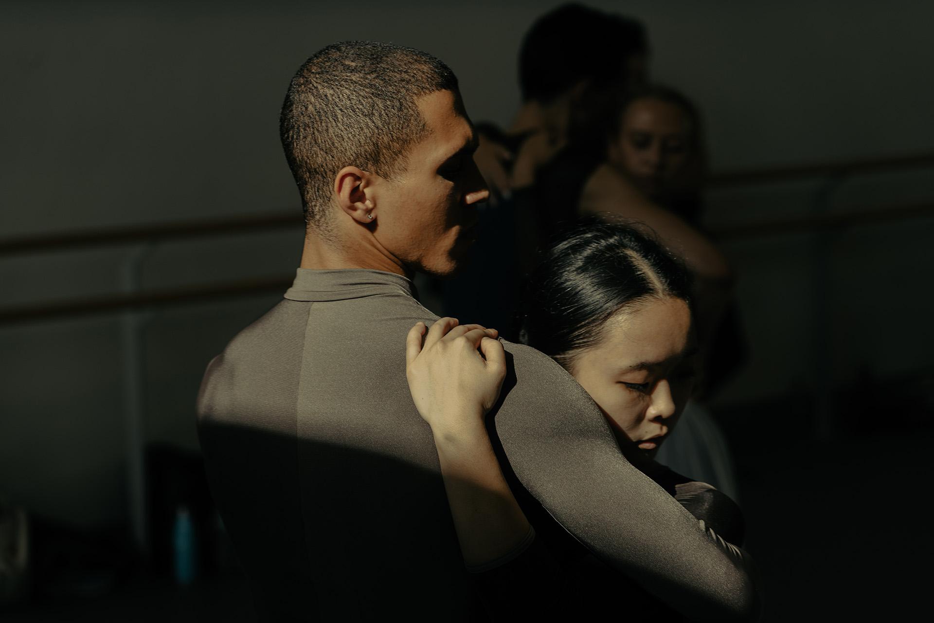 Katharine Lee rests her head against Wesley Branch's shoulder while embracing him