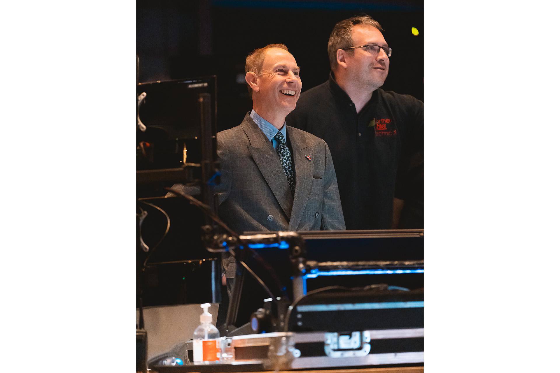 HRH Prince Edward working the lighting desk and delighted at the results