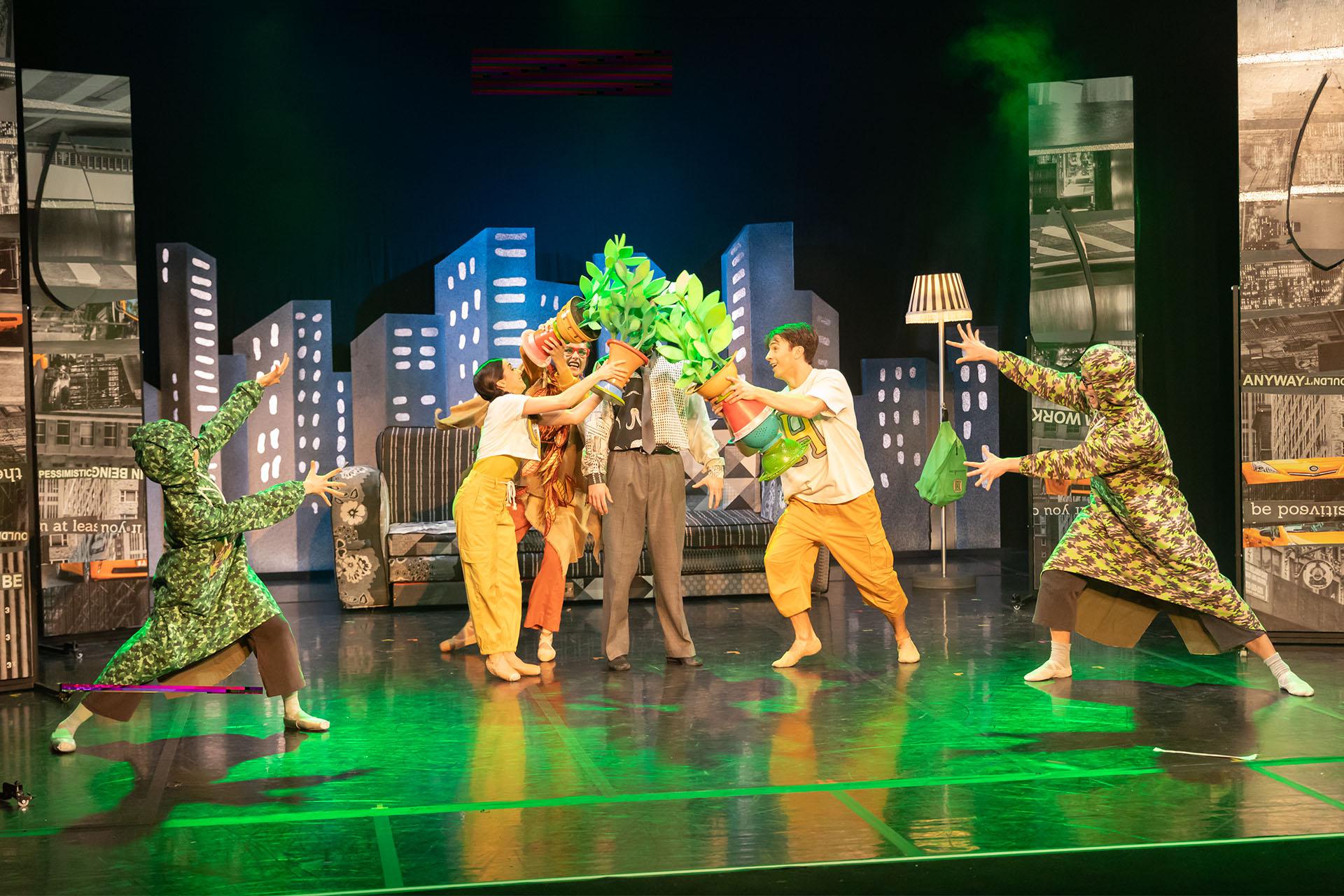 Hansel, Gretel, the Lady of the Forest and the Bird Watchers show Dad their potted plants.