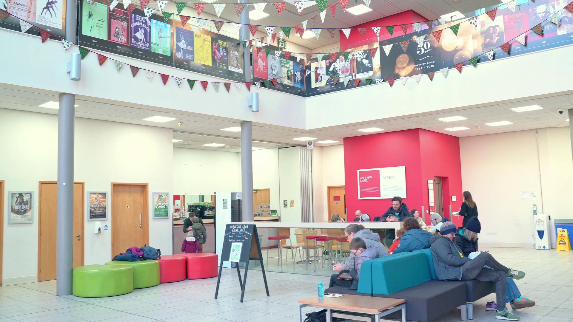 The Northern Ballet atrium with people sat