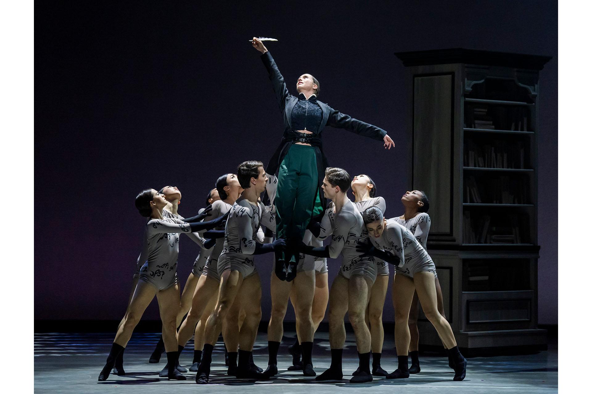 Anne Lister his held aloft by her words (a group of dancers gathered closely around her lifting her by her legs)