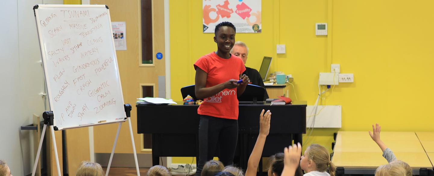 Staff member presenting to school children