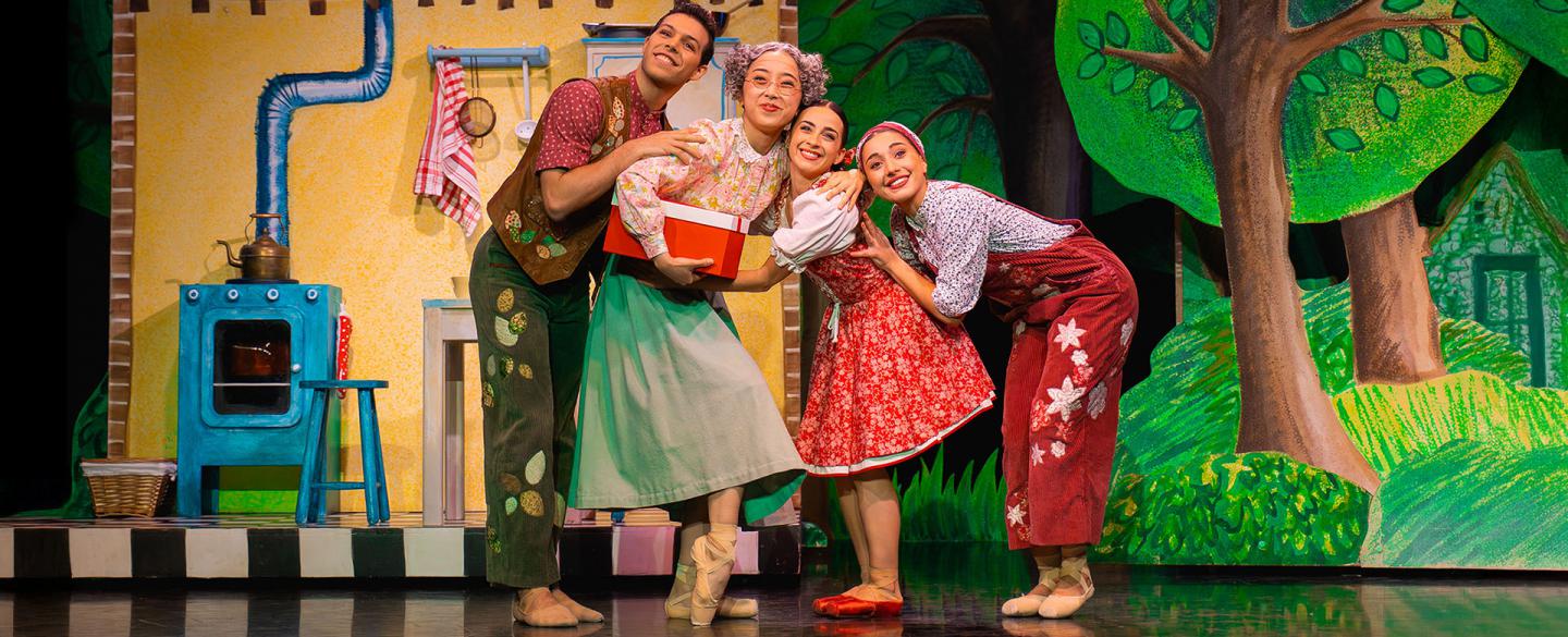 Little Red's family: father, mother, grandmother and little red hug each other happily