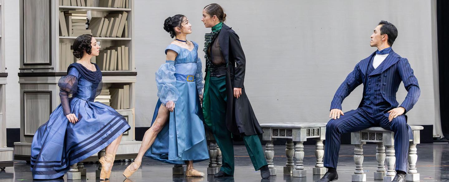 A woman in blue and Anne Lister gaze lovingly into one another's eyes