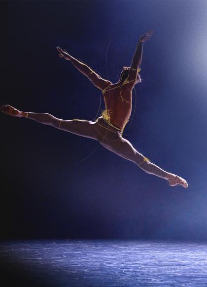 Partially in silhouette and with sketch drawing over him, a man leaps through the air, his arms stretched over and behind him and his led pointed in opposite directions