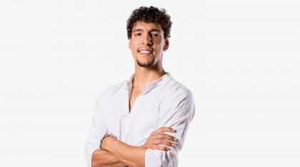 Headshot of a male dancer in a white shirt